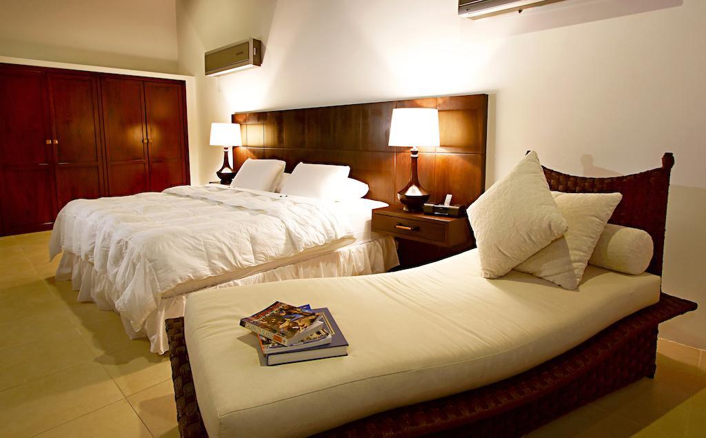 Iguana Crossing Boutique Hotel Puerto Villamil Rom bilde